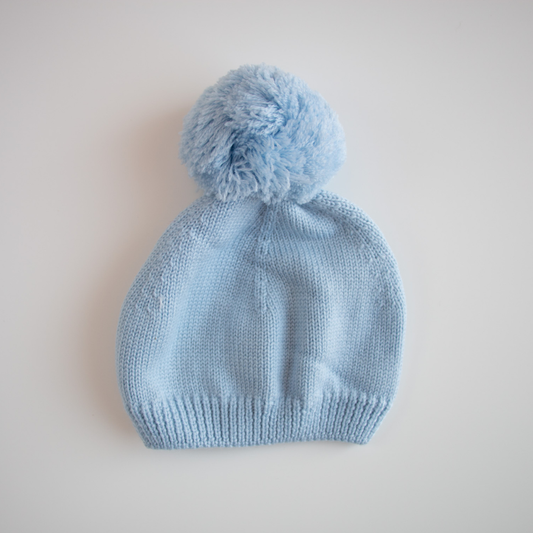 Cappellino in lana con pompon