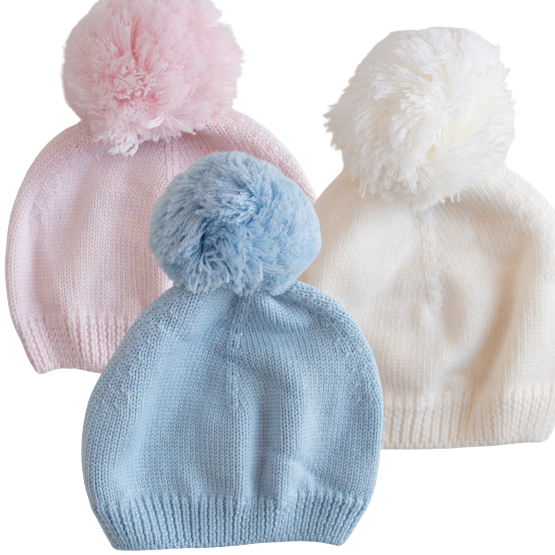 Cappellino in lana con pompon